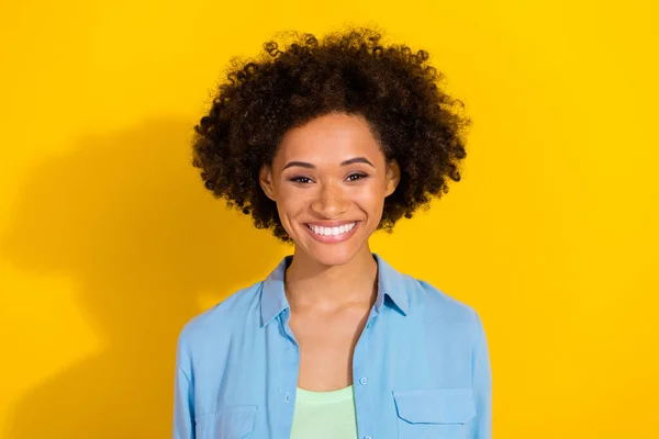 Photo of cheerful positive candid lovely lady shiny toothy smile wear jeans shirt isolated yellow color background — 스톡 사진