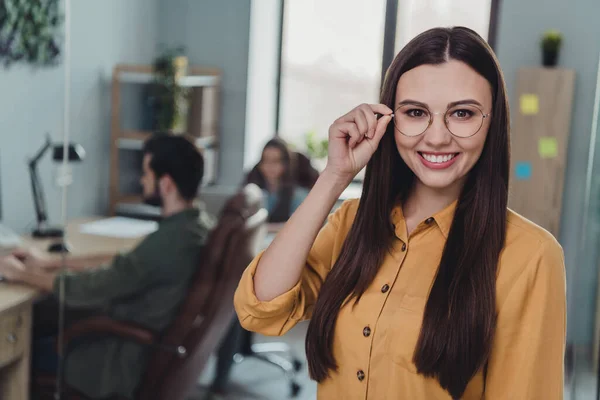 Portrait of attractive cheerful intelligent leader bookkeeper banker touching specs at workplace workstation indoors — Stock Photo, Image