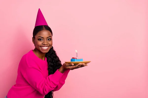 Photo of nice young brunette lady hold cake wear cap pullover isolated on pink color background — Foto Stock