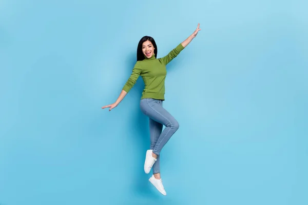 Full length body size view of attractive cheerful slim girl jumping dancing having fun isolated over shine blue color background — Foto Stock