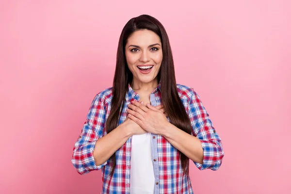 Photo of cheerful good mood young lady express her sincere feelings touch chest isolated on pink color background — Stock Photo, Image