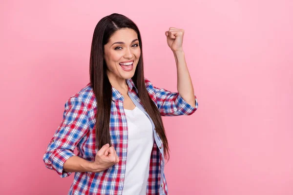 Photo of cheerful delighted funny female raise fists in victory celebrate lottery win isolated on pink color background — Stock fotografie