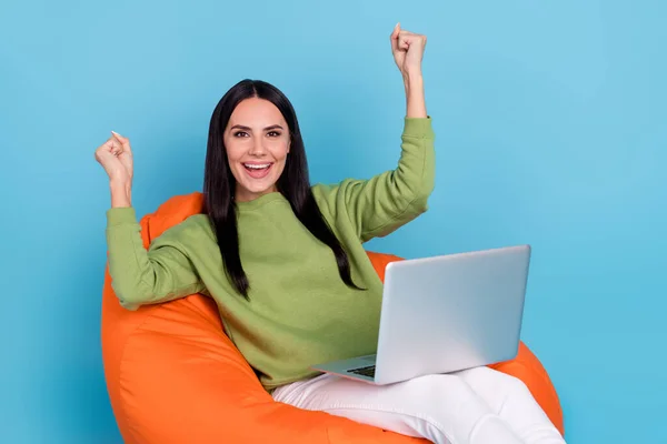 Photo of delighted positive person raise fists success achieve eshop isolated on blue color background — Φωτογραφία Αρχείου