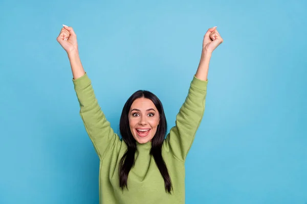 Photo of funky funny ecstatic girl raise fists in victory win in giveaway lottery isolated on blue color background — Stockfoto