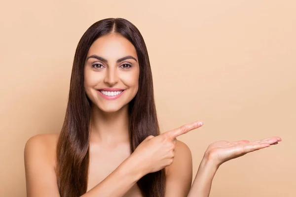 Photo of happy lady point empty space hand present silky soft cream lotion isolated pastel color background — Φωτογραφία Αρχείου