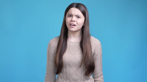 Hispanic preteen lady impressed horrible mistake isolated blue color background — Stockvideo