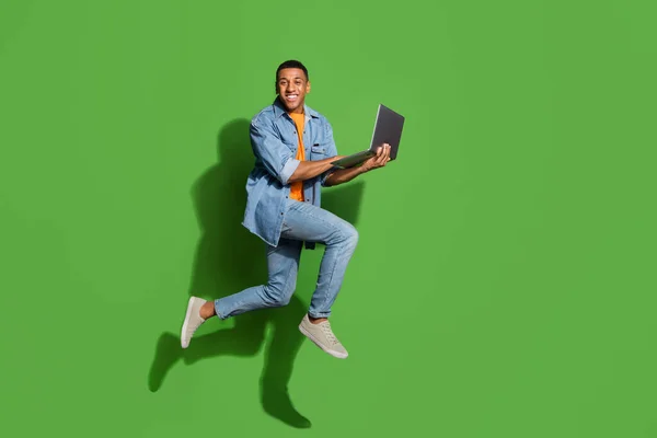 Full size profile side photo of intelligent young businessman working on new project isolated on green color background — Stockfoto