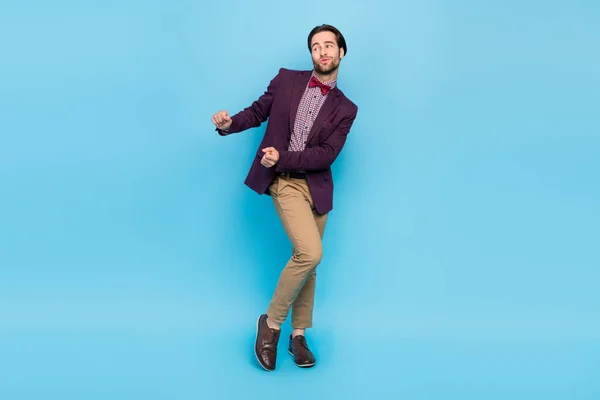 Full length photo of young man good mood dancing club event carefree isolated over blue color background — Stok fotoğraf