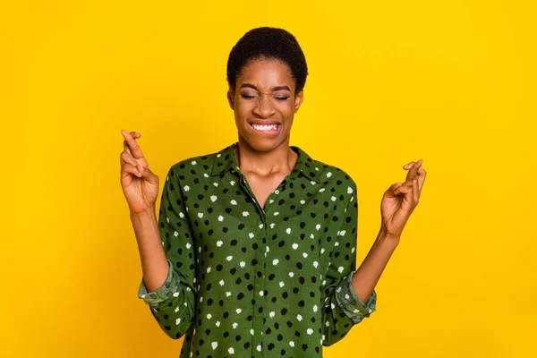 Photo of scared unsure trans human wear smart casual look fingers crossed biting lip isolated yellow color background — Stockfoto