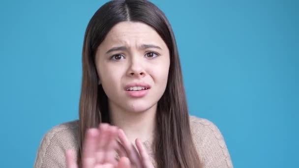 Teen lady portrait frighten horrible news avoid isolated blue color background — Video