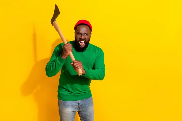 Photo of aggressive warehouse killer demand salary wear red beanie green shirt isolated yellow color background — Fotografia de Stock