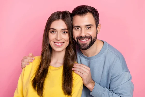 Portrait of two peaceful lovely partners embrace beaming smile look camera isolated on pink color background — Foto Stock