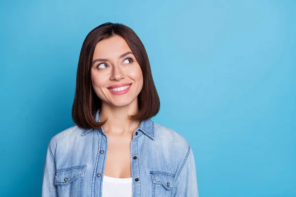 Photo of positive minded girl toothy smile look interested empty space isolated on blue color background — 스톡 사진