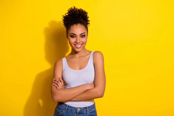Photo of nice satisfied girl crossed arms toothy smile isolated on yellow color background — Stock Photo, Image