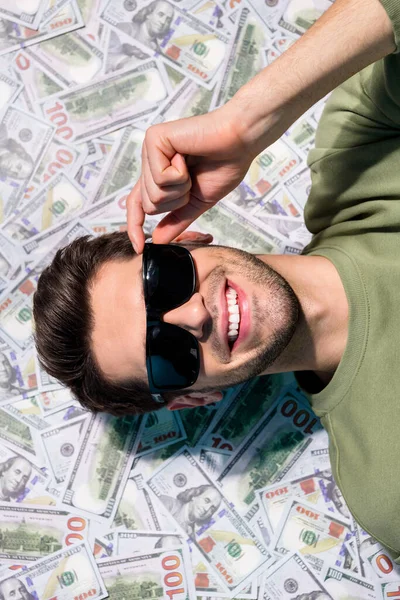 High angle view vertical portrait of nice man hand touch glasses laying money sea isolated on money background — Stock Photo, Image