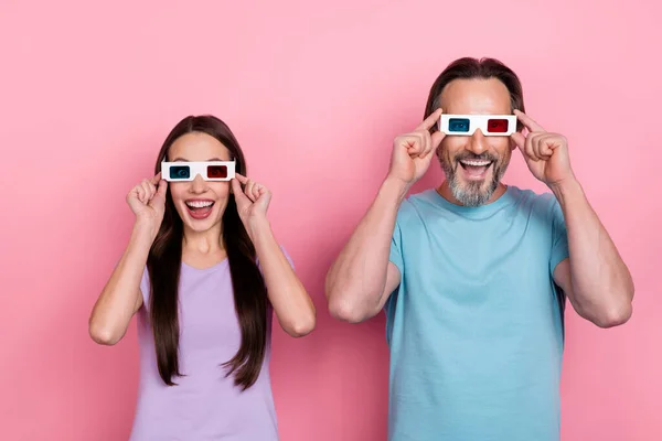 Portrait of positive funky people hands touch 3d glasses toothy smile good mood isolated on pink color background — Stock Photo, Image