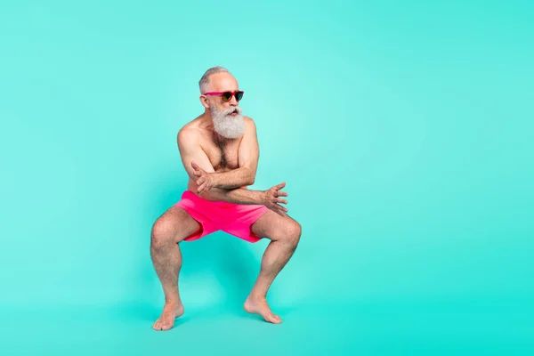Photo of funky careless old man dance make performance wear sunglass shorts isolated turquoise color background.