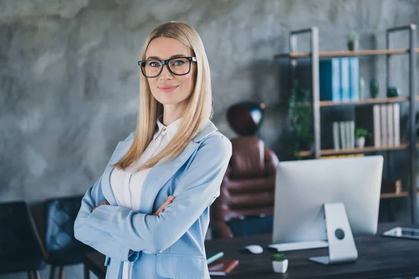 Photo of smart banker lawyer attorney lady stand folded hands own big start-up company loft workspace.