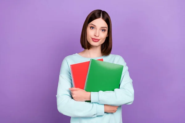 Photo portrait girl keeping book preparing to test isolated pastel purple color background.