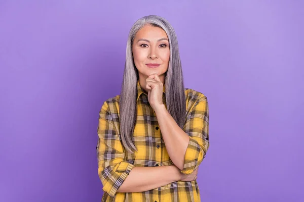 Photo of attractive mature woman minded arm touch chin intelligent isolated over violet color background.