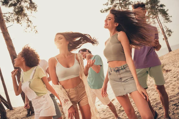 Photo of disco funky group best buddies dance enjoy summer wear casual outfit nature seaside beach outdoors.