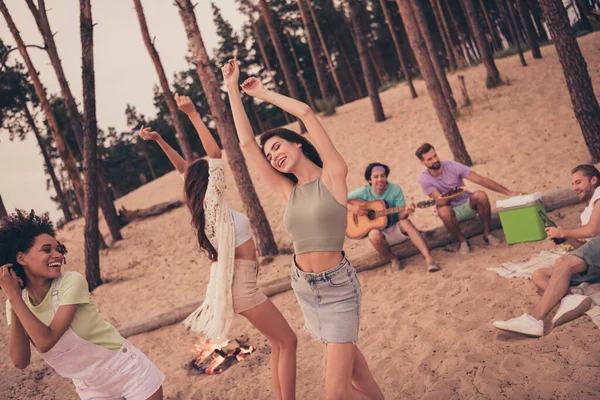 Photo of funny sweet six young diversity group dressed casual outfits dancing bonfire smiling outdoors countryside.