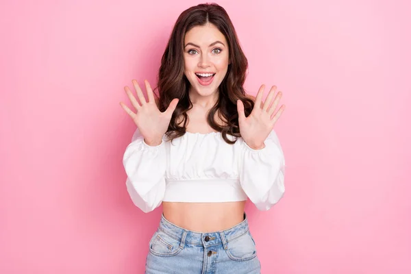 Photo of cheerful overjoyed young lady excited to see huge bargains on black friday isolated on pink color background.