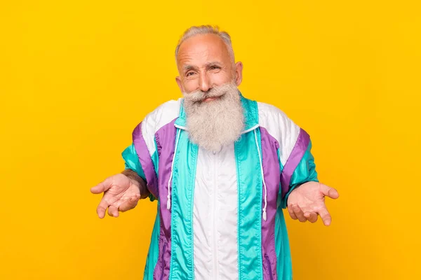 Photo of handsome doubtful aged person hands palms shrug shoulders isolated on yellow color background.