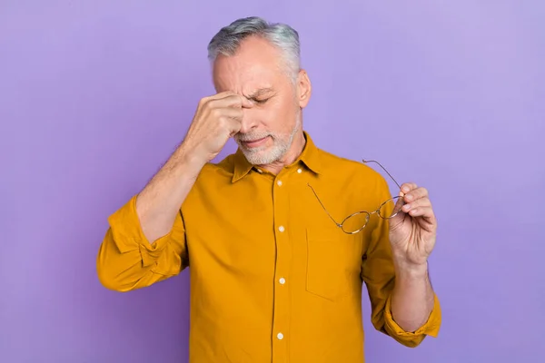 Photo of senior man hand touch nose bridge trouble unhealthy pain symptom isolated over violet color background.