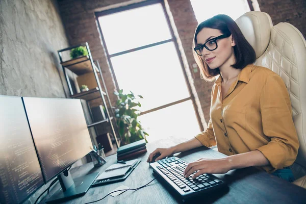 Profile photo of smart happy web designer lady sitting chair keyboard writing office building inside.