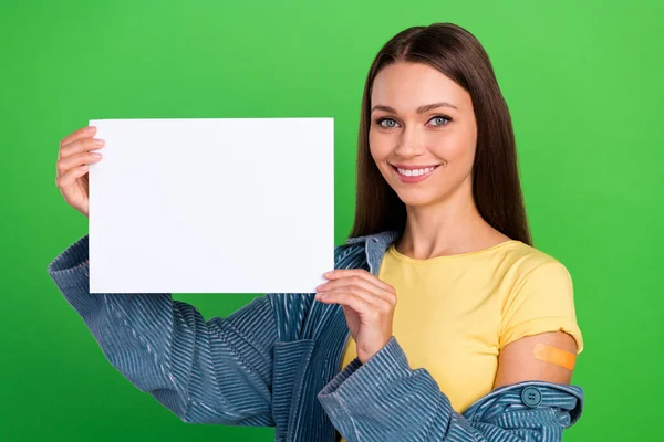 Photo of cheerful friendly person hands hold demonstrate empty space blank isolated on green color background.