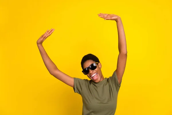 Photo of funky excited person enjoy free time clubbing isolated on yellow color background.