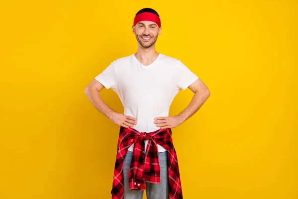 Photo portrait man in headband smiling in casual clothes isolated vivid yellow color background.