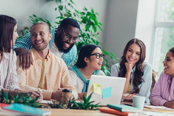 Photo of excited funny businesswoman businessman laughing telling jokes workplace workstation restaurant.