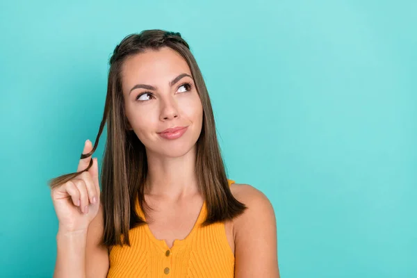 Photo of dreamy pretty happy young woman look empty space haircare imagine idea isolated on teal color background.