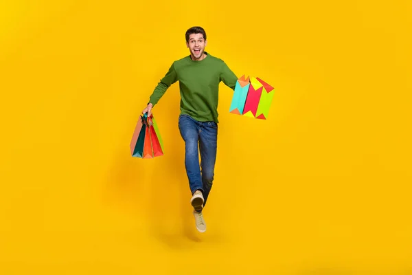 Photo Cute Excited Guy Dressed Green Pullover Jumping High Running — Stockfoto