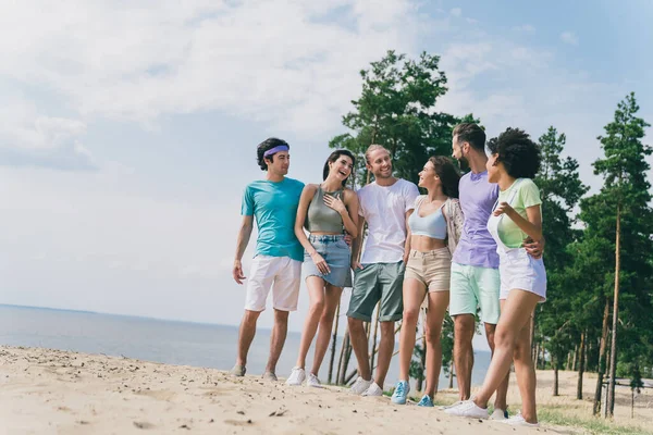 Full Size Photo Group People Embrace Stand Sand Beach Communicate — Stock Photo, Image