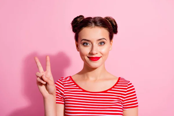 Portrait of gorgeous satisfied person hand fingers demonstrate v-sign isolated on pink color background.