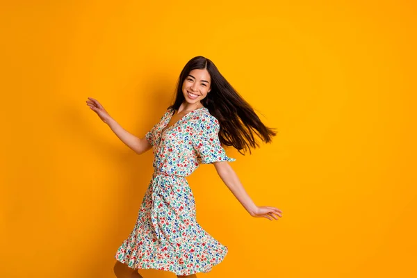 Profile photo of gorgeous positive person have good mood dancing isolated on yellow color background.