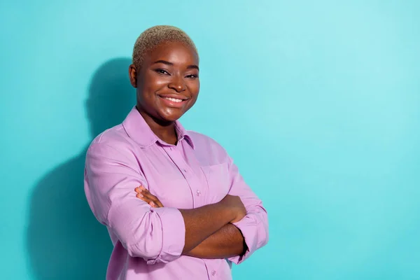 Profile portrait of cheerful charming person crossed arms toothy smile isolated on teal color background.