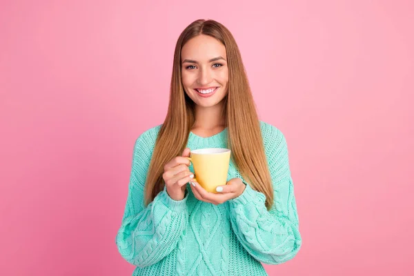 Portrait of satisfied adorable person toothy smile arms hold fresh coffee cup isolated on pink color background.