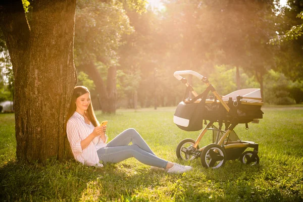 Full Size Portrait Charming Lady Sitting Grass Use Telephone Baby — Fotografia de Stock