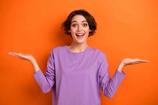 Photo Sweet Excited Girl Dressed Purple Pullover Comparing Arms Empty — Foto Stock