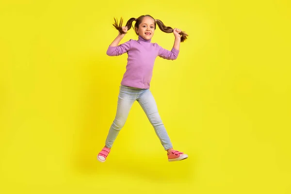 Full Body Photo Sweet Preschooler Girl Jump Touch Pigtails Enjoy — Fotografia de Stock