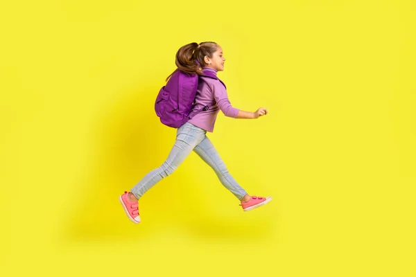 Full Size Profile Side Photo Elementary School Girl Jump Rush — Stockfoto