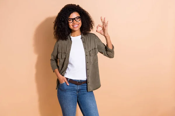 Portrait Attractive Cheerful Content Girl Showing Sign Solution Isolated Beige — Fotografia de Stock