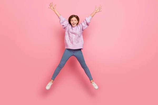 Photo Cute Excited Girl Knitwear Sweater Jumping High Star Isolated — Stockfoto
