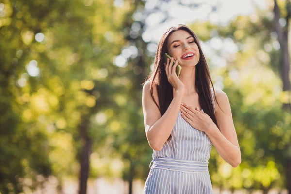 Photo Adorable Cheerful Girl Have Conversation Telephone Walk Park Warm — Stock Fotó