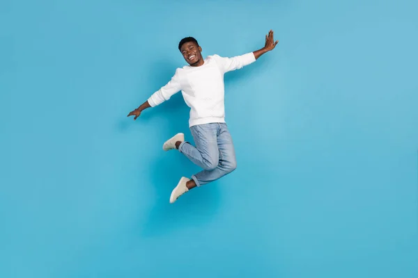Full Size Photo Overjoyed Person Enjoy Freedom Jumping Isolated Blue — Stockfoto
