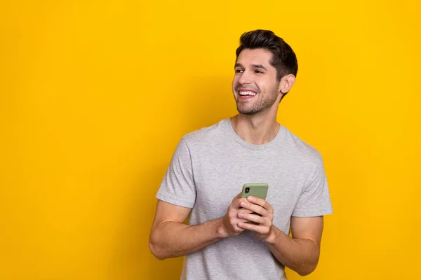 Photo Impressed Brunet Millennial Guy Hold Telephone Look Promo Wear — 图库照片